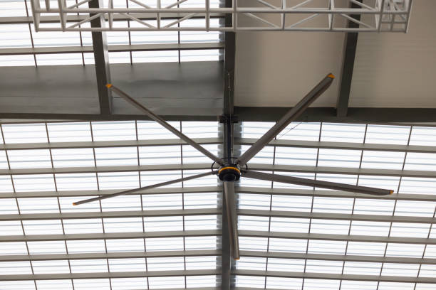 istock A large fan is mounted on the ceiling of a building 2161975959