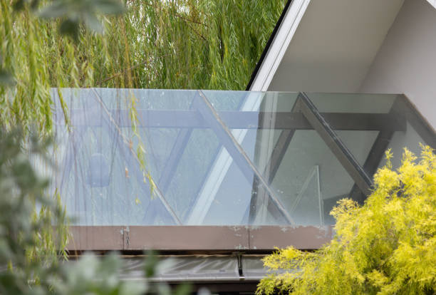 istock A glass roof with a tree in the background 2161975963