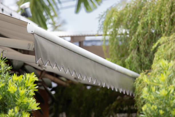 istock A white and silver awning with a white stripe and a black stripe 2161975972