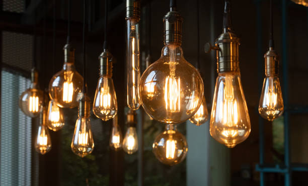 istock A bunch of light bulbs hanging from the ceiling 2161975998