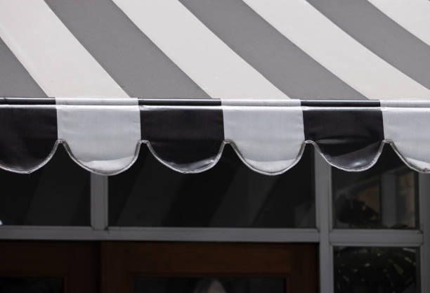 istock A black and white striped awning with a white stripe 2161976018