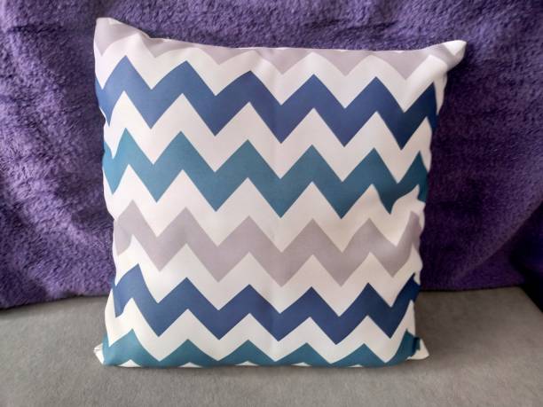 istock Blue and gray chevron pattern throw pillow on a purple background. 2161978848