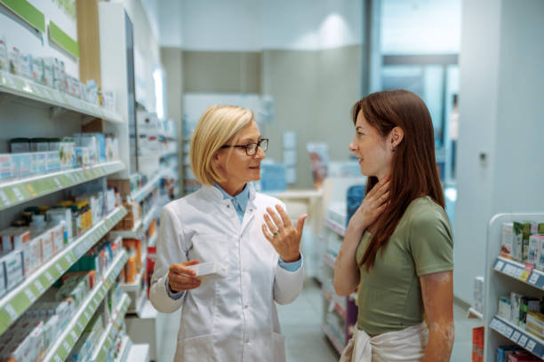 istock Pharmacist and customer discussing prescription in pharmacy store 2161979540