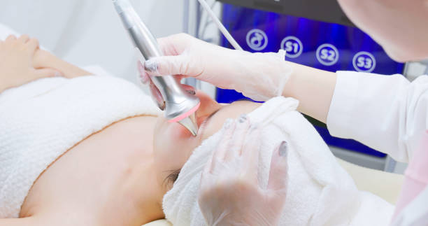 istock asian beautician use beauty device 2161979645
