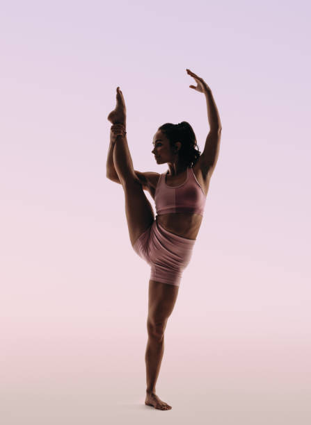 Graceful movement of an agile acrobat in a silhouette pose