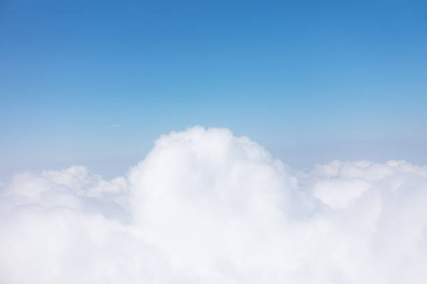 istock Scenic sky view from airplane with fluffy clouds 2161985112