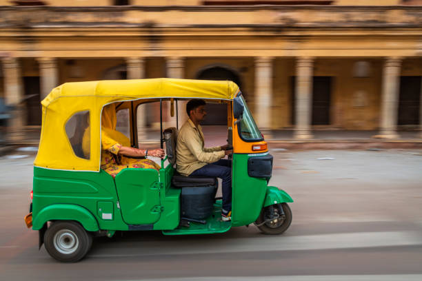istock Indian man drives auto rickshaw (tuk-tuk), India 2161986351