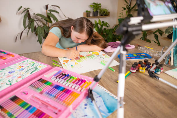 istock Young Girl with Down Syndrome Creates Art 2161987668