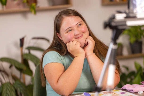 istock Girl with Down Syndrome Vlogs Her Art 2161988676