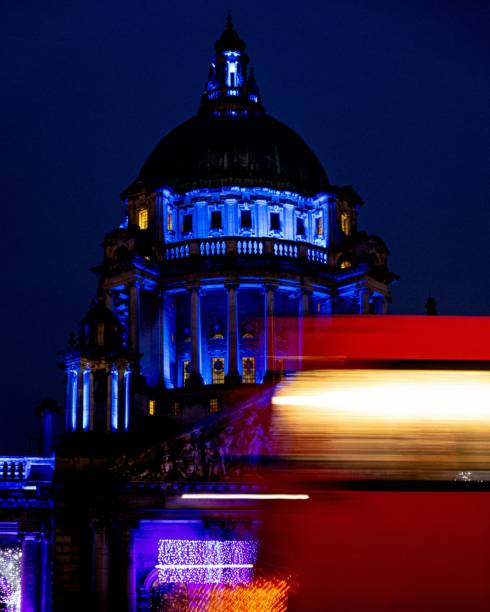 istock View of St. Paul's Cathedral illuminated in blue with a red double-decker bus 2161989985