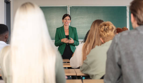 istock Female teacher talking to students 2161990090