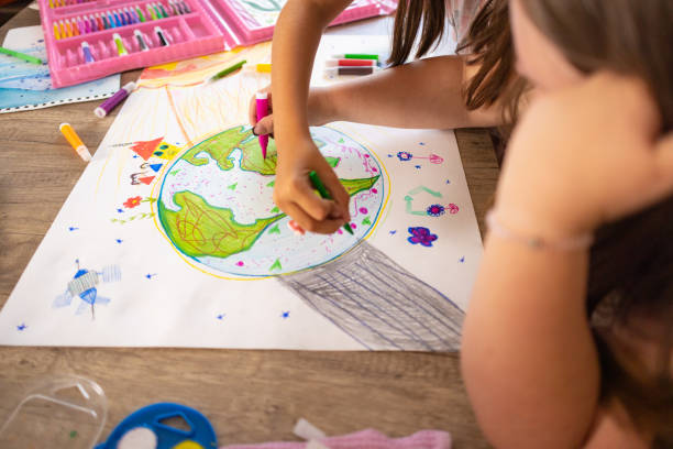 istock Down Syndrome Girl at Desk Drawing 2161990683