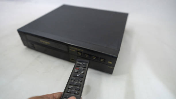 istock VCR with old VHS tapes and remote control 2161990704