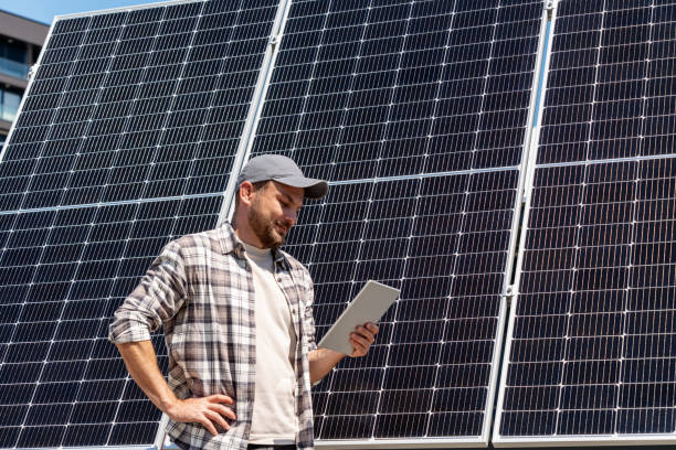 istock Male technician monitoring solar panel performance with digital tablet. 2161990888