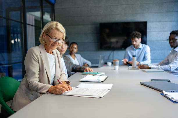 istock Business Strategy: Senior Director leads the team through important documents and plans 2161994018
