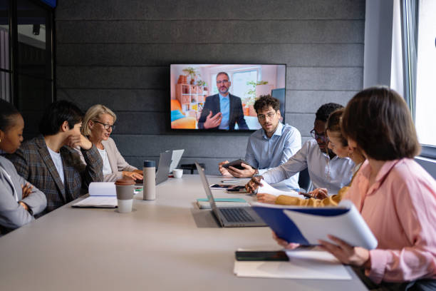 istock Professional video meeting: team members talk to the CEO while working on a task 2161994028