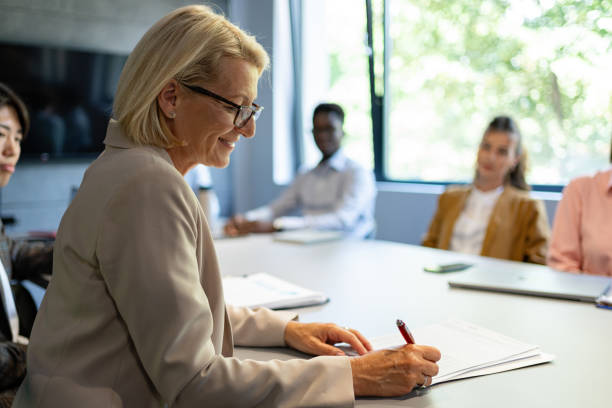 istock Business Strategy: Senior Director leads the team through important documents and plans 2161994052