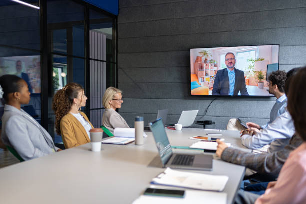 istock Colleagues on online meeting in modern office with CEO 2161994150