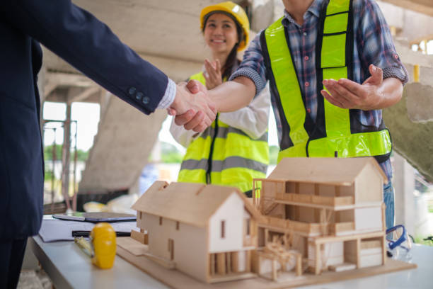 istock Civil engineer or construction manager with businessman shaking hands at construction site. Building,  and real estate business. 2161995924