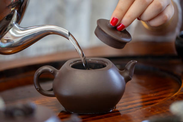 istock A woman is pouring tea 2161995959