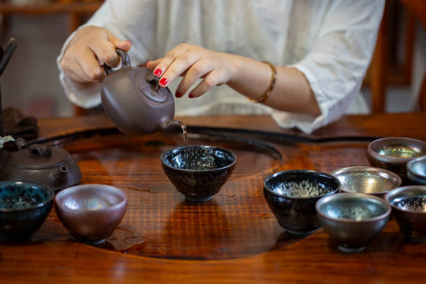istock A woman is pouring tea 2161995960