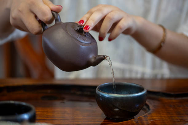 istock A woman is pouring tea 2161995964