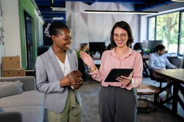 istock Positive atmosphere: Female leaders discuss achievements with the help of tablets 2161996057