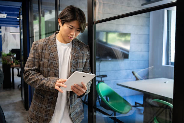 istock Innovative young leader is considering new business ideas on a tablet 2161996098