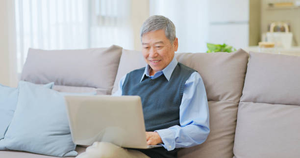 istock asian elderly man use laptop 2161998601