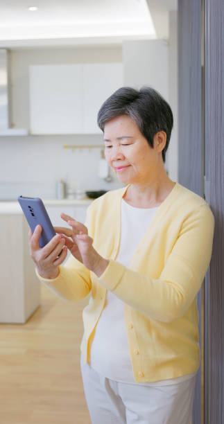 istock asian old female learn tehnology 2161998671