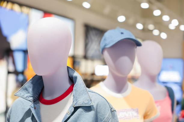 istock clothes fitting mannequins in a clothing store. 2162001882