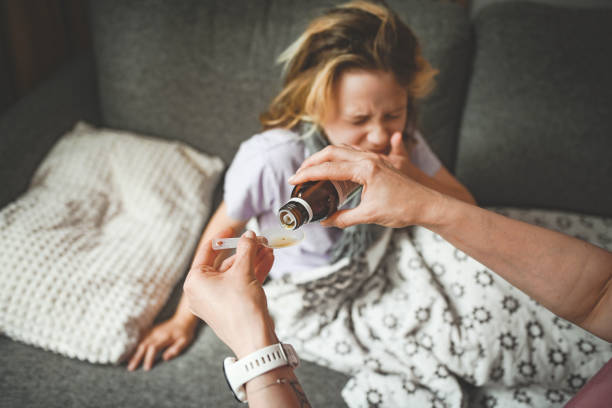 istock doctor examines a sick child 2162002544