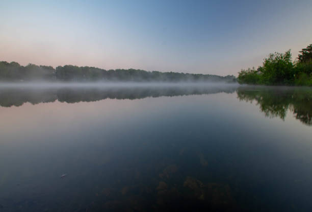 istock The surface of a misty lake at dawn. 2162002891