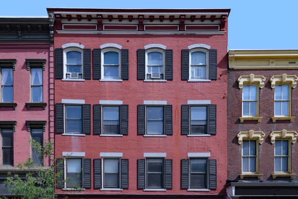 istock 19th century building facades with ornate window frames and roof cornice 2162003702