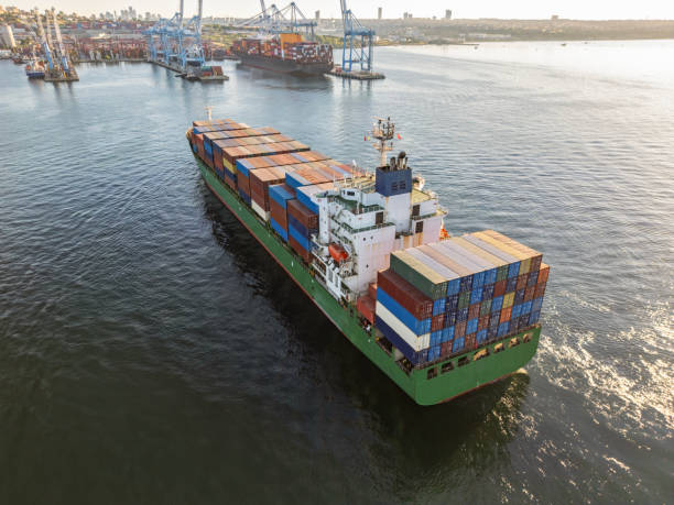 istock Aerial view of Cargo Container Ship approaching port with tugboat. 2162007691