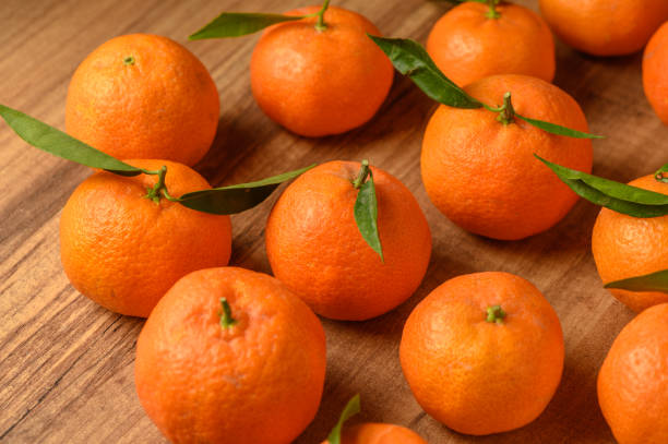istock fresh juicy tangerines on a wooden table 15 2162009776