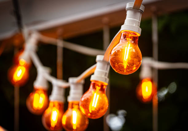 istock Festive glowing light bulbs at night 2162011142