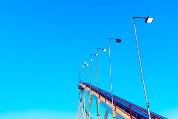 Series of lights are lined up on roller coaster. Illumination lamps at carousel