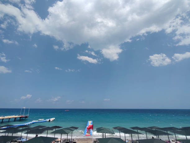A row of umbrellas and sunbeds at the beach