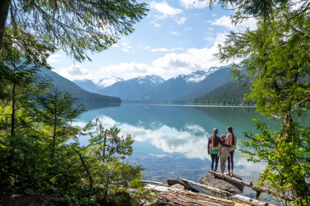 istock Family explores lakeshore together 2162013842