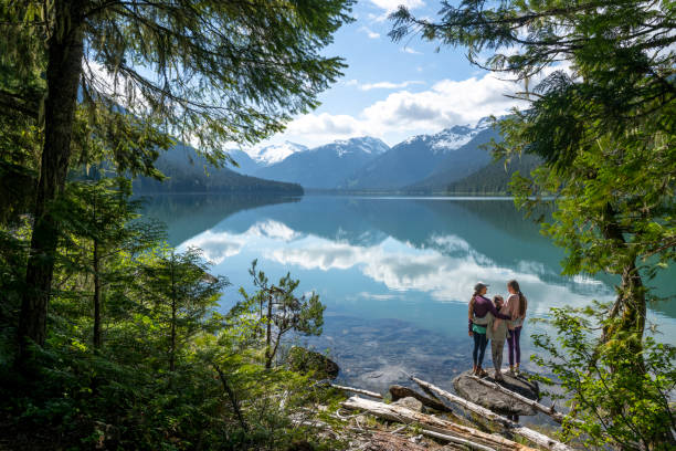 istock Family explores lakeshore together 2162013847