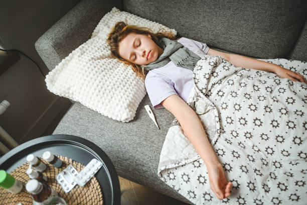 istock cold girl lying on the sofa 2162016570