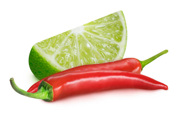 istock Lime and chili peppers on an isolated white background. 2162021003