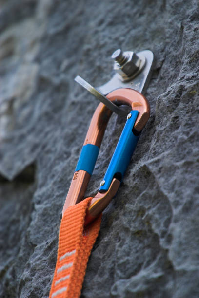 istock A quickdraw carabiner attached to a rock cliff 2162025841