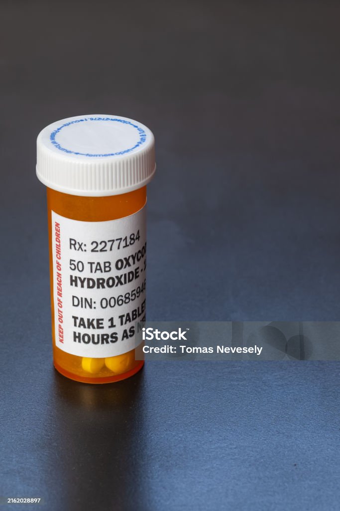Prescription bottle with backlit Oxycodone tablets. Oxycodone is a generic prescription opioid. Prescription bottle with backlit Oxycodone tablets. Oxycodone is a generic prescription opioid. A concept of the opioid epidemic crisis Methadone Stock Photo Prescription bottle with backlit Oxycodone tablets. Oxycodone is a generic prescription opioid. Prescription bottle with backlit Oxycodone tablets. Oxycodone is a generic prescription opioid. A concept of the opioid epidemic crisis Methadone Stock Photo