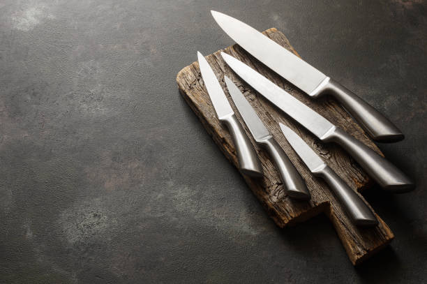 Casting steel various chef knife, Set of modern sharp kitchen knives on dark background