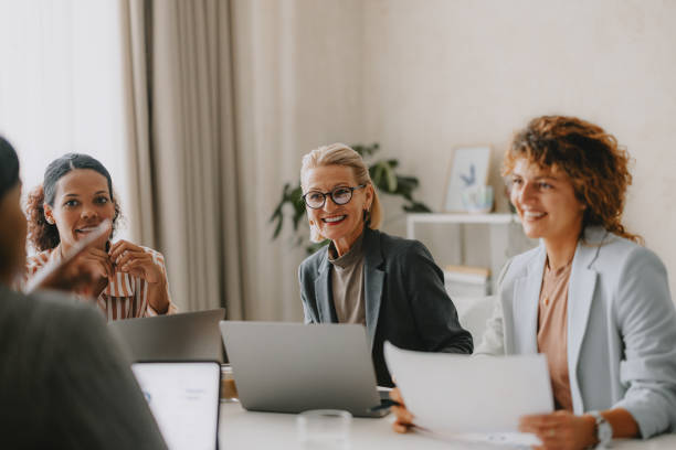 istock Diverse Business Team Collaborating in Bright Beige Office 2162033414