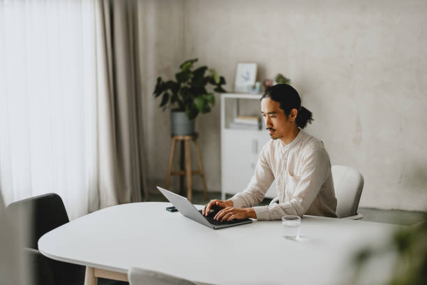 Business Professional Working on Laptop in Minimalist Office Space