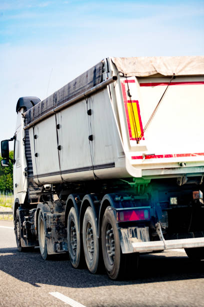 istock Tipper semi-trailer on the highway 2162038232
