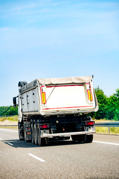 istock Tipper semi-trailer on the highway 2162038446